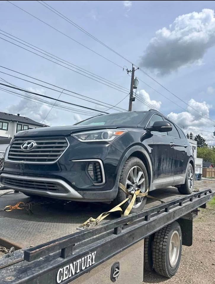 Flatbed tow truck for emergency towing in Calgary